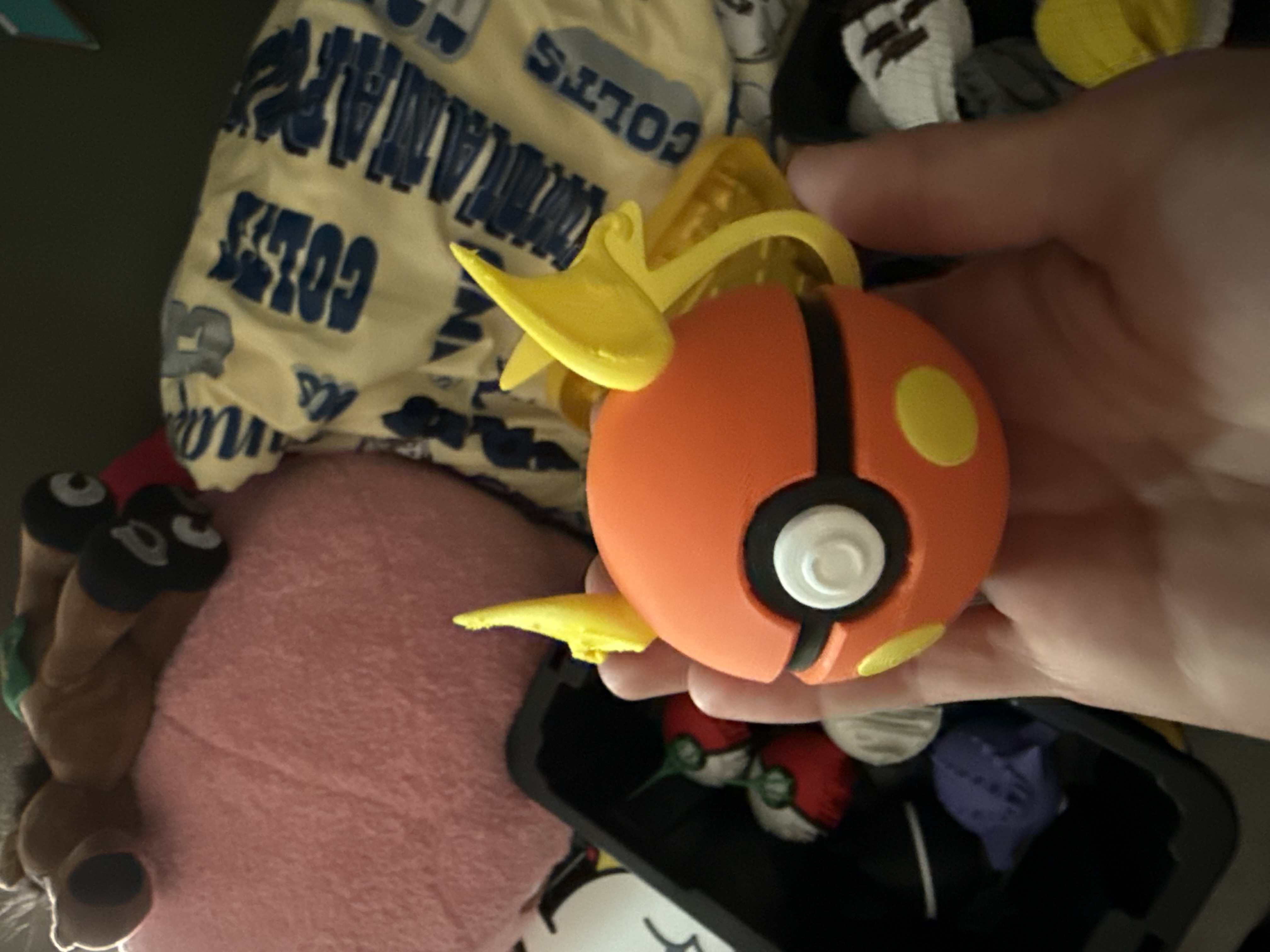 Charizard-themed Pokéball in orange and yellow
