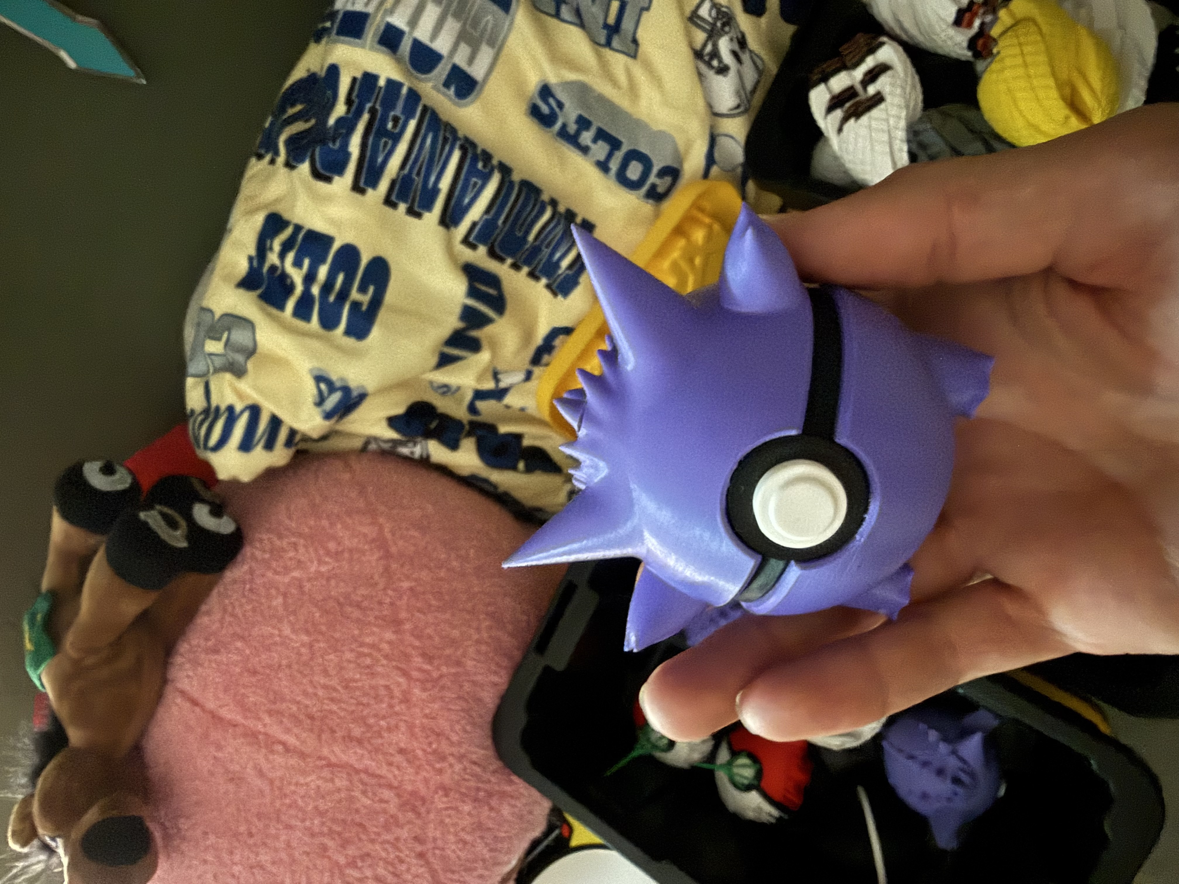 Gengar-themed Pokéball in purple with spiky ears